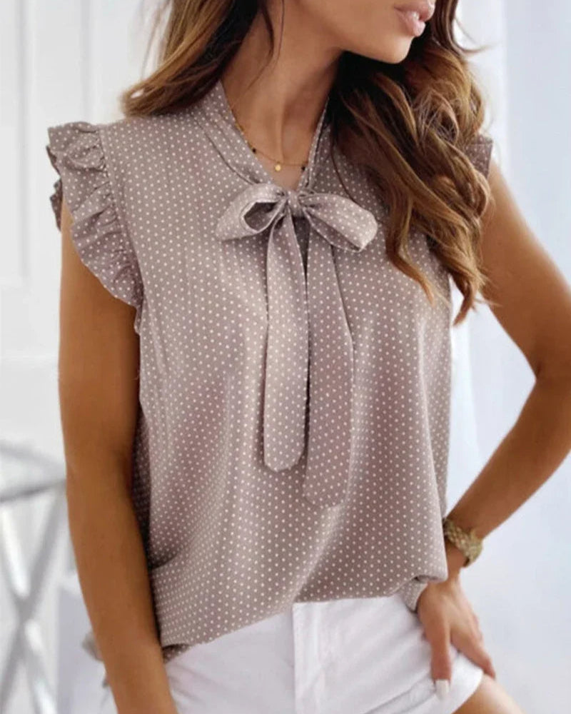 Sleeveless Blouse with Ruffles and Bow Detail